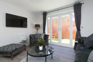 Телевизор и/или развлекательный центр в Stunning 2 Bedroom Apartment in Wallasey