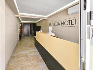 a lobby of a hotel with a reception desk at Lucia Hotel Paralia in Paralia Katerinis