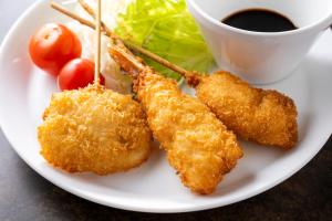 a plate of food with shrimp and a cup of coffee at Just Sleep Osaka Shinsaibashi in Osaka