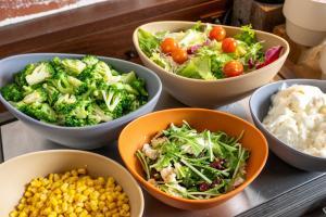 a group of bowls filled with different types of food at Just Sleep Osaka Shinsaibashi in Osaka