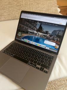 a laptop computer sitting on top of a table at Villa Flamenca in Nerja