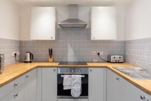 Η κουζίνα ή μικρή κουζίνα στο Charming 1 Bedroom Apartment in Leeds +8 φωτογραφίες
