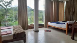 Postel nebo postele na pokoji v ubytování Dew Lee Homestay & Farm House