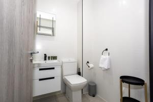a white bathroom with a toilet and a sink at Fantastic 1 Bedroom Apartment in Preston Centre in Preston