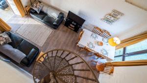 an overhead view of a living room with a couch at Charming 3 Bedroom Holiday Cottage nr Bude in Bude