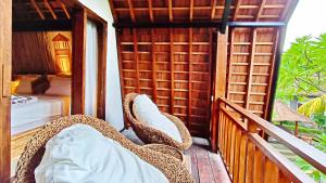 Postel nebo postele na pokoji v ubytování Kies Villas Lombok