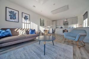 a living room with a couch and a table at Contemporary 2 Bedroom Apartment in Ashford in Ashford
