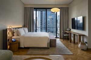 a hotel room with a bed and a balcony at Else Kuala Lumpur in Kuala Lumpur