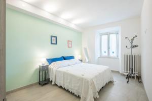 Postel nebo postele na pokoji v ubytování Casa nel cuore di Radicondoli