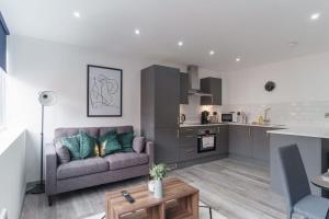 a living room with a couch and a kitchen at Fantastic 1 Bedroom Apartment in Preston in Preston