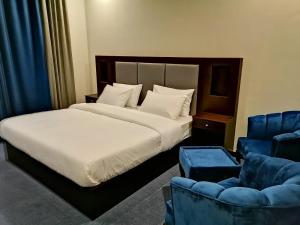 Voodi või voodid majutusasutuse Kallisto Hotel toas