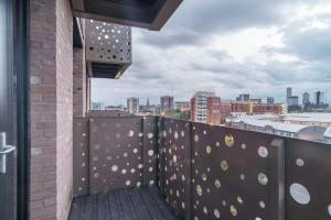 a balcony with a view of a city at Spacious Studio in Central Liverpool in Liverpool