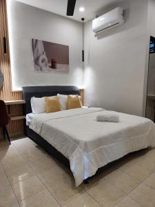 Postel nebo postele na pokoji v ubytování Rentio Homestay + 7 fotografií