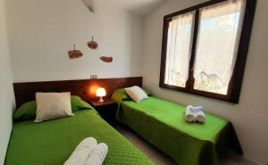 Postel nebo postele na pokoji v ubytování Ferienhaus Casa Mirto - Villaggio Galanu + 15 fotografií