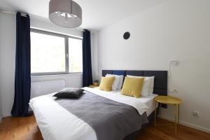 Postel nebo postele na pokoji v ubytování ArtApartment G 13