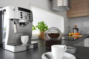 Příslušenství pro přípravu čaje a kávy v ubytování ArtApartment G 13