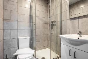 a bathroom with a shower and a toilet and a sink at Contemporary 1 Bed Budget Flat in Central Halifax in Halifax