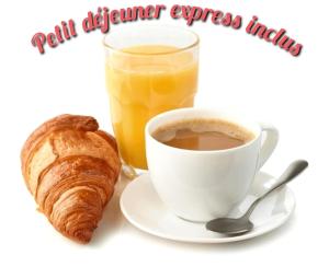 a cup of coffee and a croissant and a glass of orange juice at Le Relais Des Dames in Neuville-sur-Saône