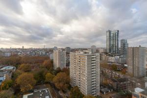an aerial view of a city with tall buildings at 3 Bedroom Old Street Apartment - Amazing Views in London