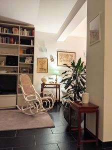 a living room with two chairs and a table at La casa sul lago in Trevignano Romano