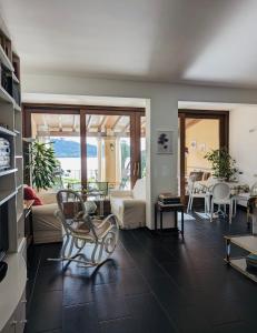 a living room with a couch and a chair at La casa sul lago in Trevignano Romano