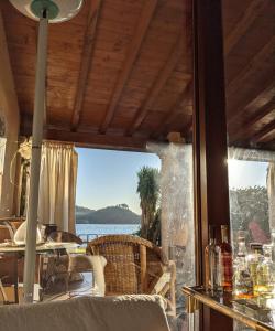 a living room with a view of the water at La casa sul lago in Trevignano Romano +32 photos