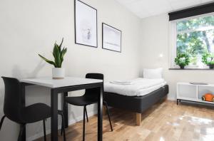 Postel nebo postele na pokoji v ubytování Forenom Hostel Lund Örtofta