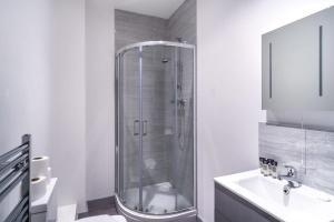 a bathroom with a shower and a sink at Smart 1 Bedroom Apartment in Blackburn in Blackburn
