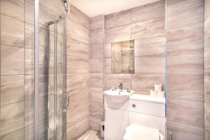 a bathroom with a sink and a shower at Contemporary 1 Bed Apartment in Central Preston in Preston