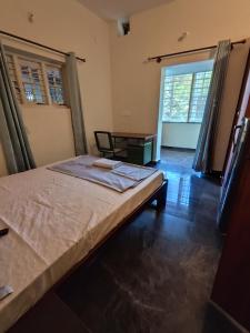Uma cama ou camas num quarto em Brindaven