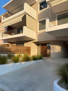 a building with a walkway in front of it at Phos Luxury Apartment in Lefkada