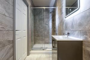 a bathroom with a shower and a sink at Smart 1 Bed Budget Apartment in Darlington in Darlington