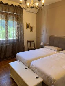 Postel nebo postele na pokoji v ubytování Residenza Sandrini