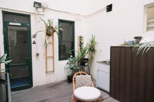 a patio with a table and a chair at CarricHostel in Melbourne