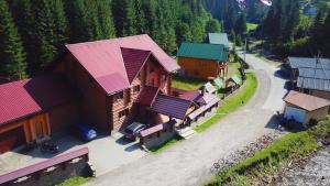 an overhead view of a house with red roof at Hotel Berloga-Sinevir in Synevyrsʼka Polyana