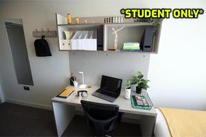 a desk with a laptop computer on top of it at Student Only Zeni Ensuite Rooms Belfast in Belfast