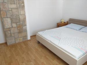 Posteľ alebo postele v izbe v ubytovaní Apartment Bugenvila