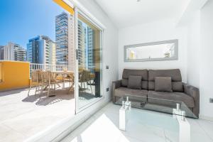 A seating area at Penthouse Ancla 561 Levante Beach
