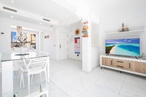 A television and/or entertainment centre at Penthouse Ancla 561 Levante Beach