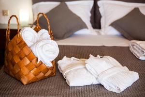 A bed or beds in a room at Aigli Luxury Villa - Seaview Panoramic Retreat