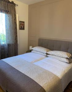 Postel nebo postele na pokoji v ubytování Residenza Sandrini