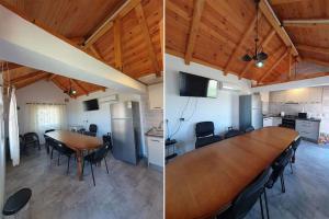 a dining room and kitchen with a large wooden table at Lotca_lu_Vasile in Crisan +9 photos