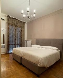 Postel nebo postele na pokoji v ubytování Residenza Sandrini