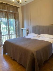 Postel nebo postele na pokoji v ubytování Residenza Sandrini