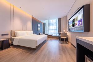 Postel nebo postele na pokoji v ubytování Atour Hotel Guangzhou Huangpu Development Zone Baoying