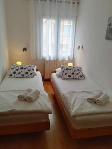 Postel nebo postele na pokoji v ubytování Apartmani Melia