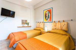 A bed or beds in a room at Kitries Summer Getaway - Eden Cozy Suite