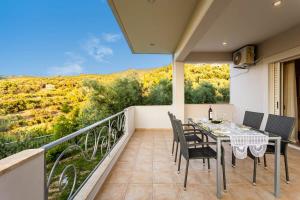 A balcony or terrace at Kitries Summer Getaway - Eden Cozy Suite