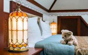 Postel nebo postele na pokoji v ubytování Villa Stanislavskyi Hotel