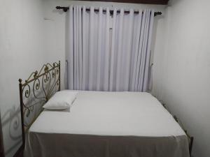 מיטה או מיטות בחדר ב-Mandara Bliss Retreat - මන්දාරා